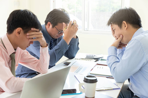 Business and finance concept of office working,Teamwork of Businessmen stressing after investment business plan not success - 写真・画像