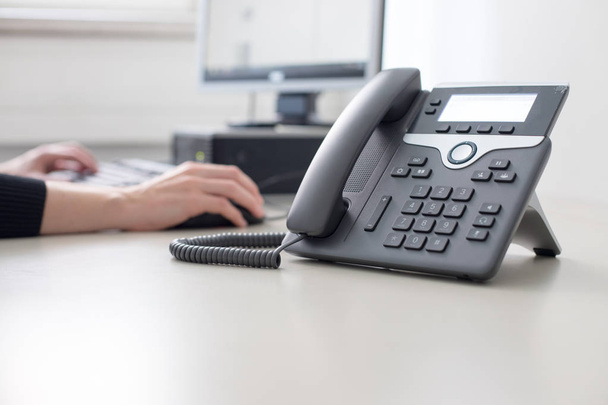 Classical black telephone in the office, customer support and te - Fotografie, Obrázek