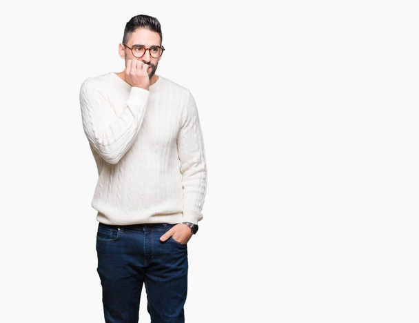 Young handsome man wearing glasses over isolated background looking stressed and nervous with hands on mouth biting nails. Anxiety problem. - Photo, Image