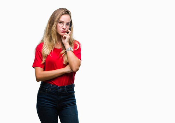 Young beautiful blonde woman wearing glasses over isolated background thinking looking tired and bored with depression problems with crossed arms. - Fotoğraf, Görsel