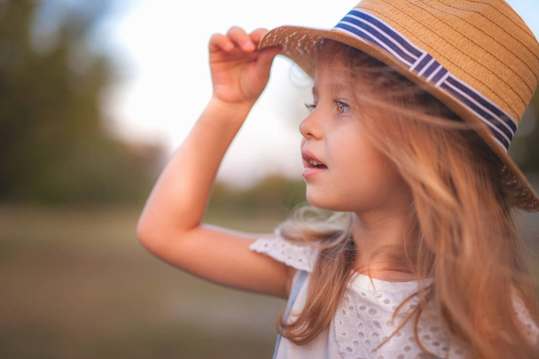 Summer outdoor portrait of beautiful happy child - Фото, изображение