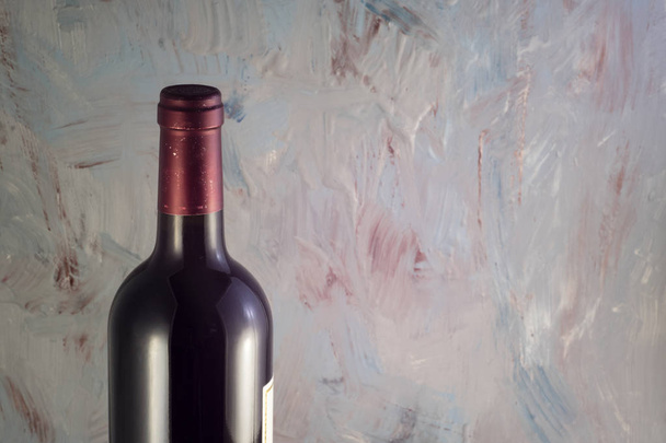 Bottle of wine on gray scenic background - Photo, Image