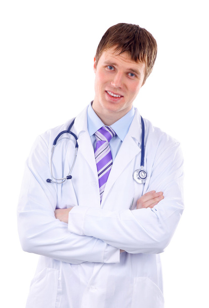 Smiling medical doctor with stethoscope. Isolated over white background - Photo, Image