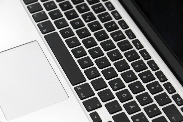 Computer keyboard on a black background / notebook keyboard technology background - Photo, Image