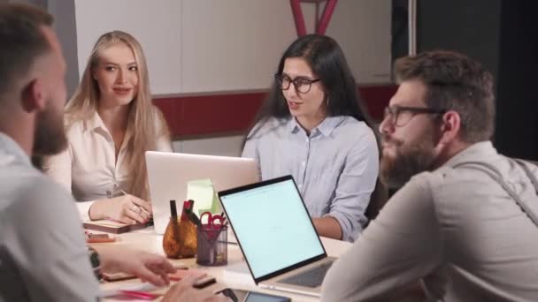 Group of seo-specialists are meeting in office in evening time - Footage, Video