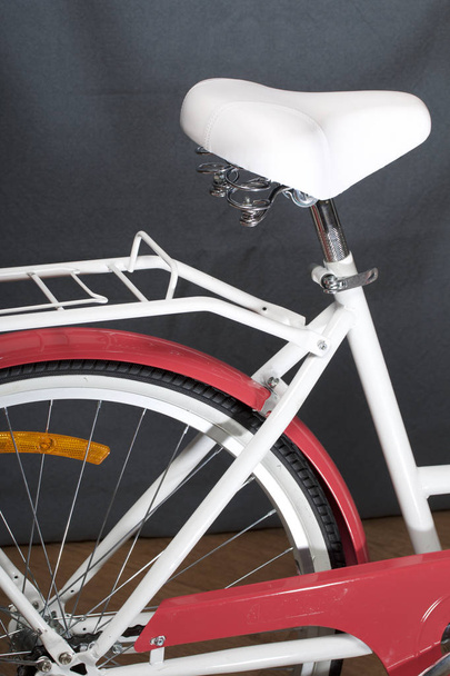 Elements of a female bicycle in white and pink color.  Frame, pedals and wheel. Spring and summer recreation and sports. - Fotó, kép