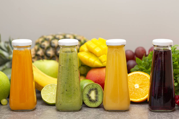 Assortment of fruit and vegetables smoothies in glass bottles. Fresh organic Smoothie ingredients. Detox, dieting or healthy food concept. Vegetarian food. - Fotoğraf, Görsel