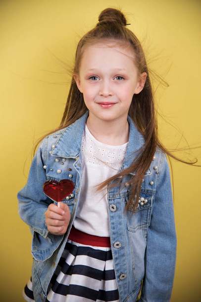 portrait of a girl with candy - Zdjęcie, obraz