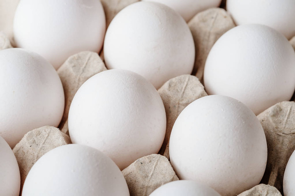 Many white chicken eggs food in tray box  - Foto, Bild
