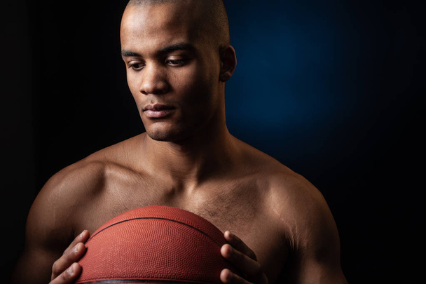 Portrait of afro american male basketball player with a ball - Foto, Bild