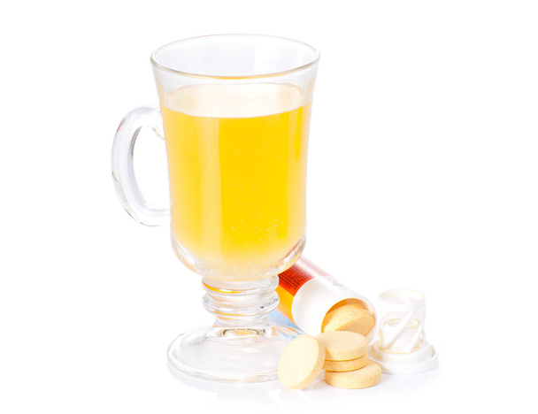 The glass of soluble vitamin C pills lying near - Foto, Imagem