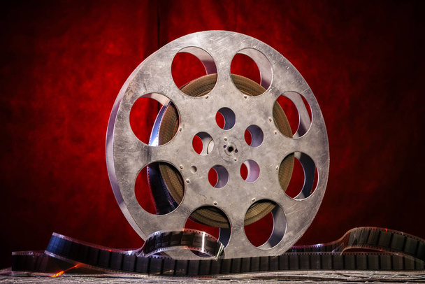 35 mm film reel with dramatic lighting on a dark background - Photo, Image