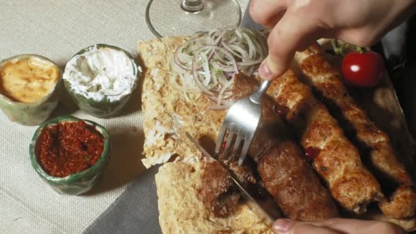 close-up shooting: grilled meat, kebab with vegetables and various sauces. - Footage, Video