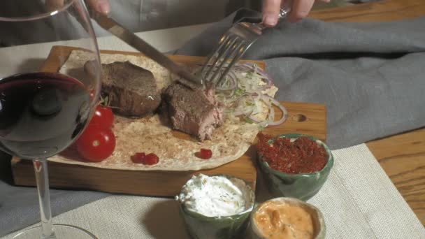 close-up shooting: grilled meat with vegetables and various sauces - Footage, Video