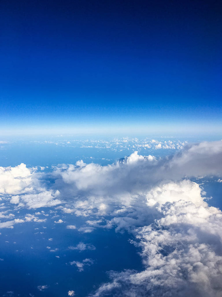 View from the airplane window, sky and ocean blue - Фото, зображення