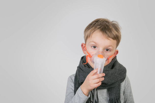 Sick boy doing inhalation - Foto, afbeelding