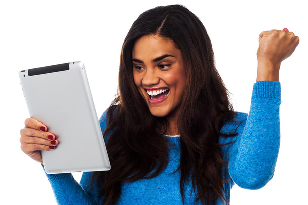 Excited woman holding touch pad - Photo, Image