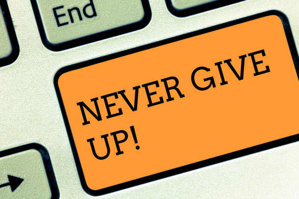 Text sign showing Never Give Up. Conceptual photo Be persistent motivate yourself succeed never look back Keyboard key Intention to create computer message pressing keypad idea. - Photo, Image