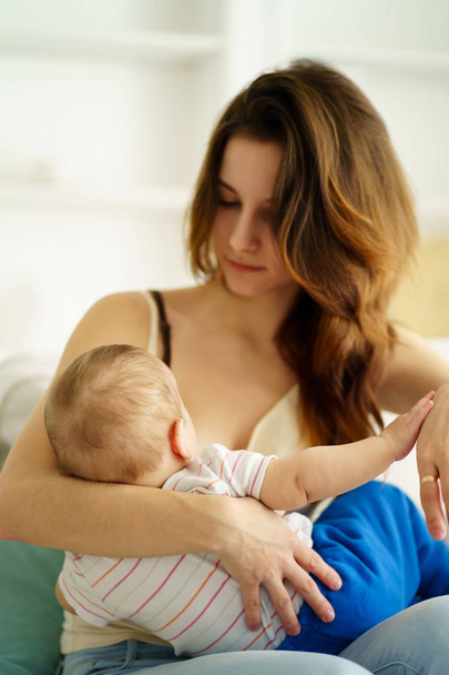 young mother breastfeeding her little son - Photo, Image
