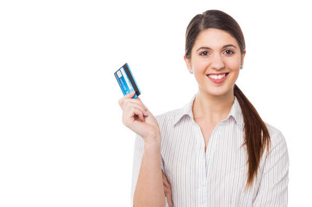Smiling elegant woman holding credit card - 写真・画像