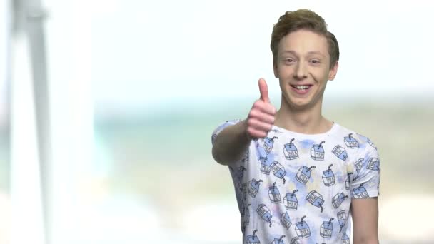 Cute teen boy giving thumbs up. - Footage, Video
