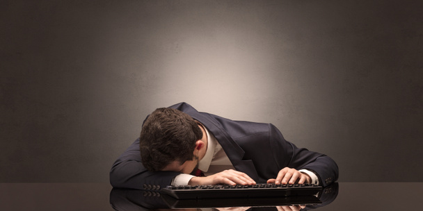 Businessman fell asleep at his workplace - Foto, imagen
