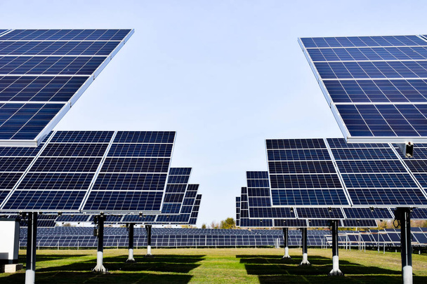 A large station of solar panels on a clear day. Bright new solar panels - Photo, image