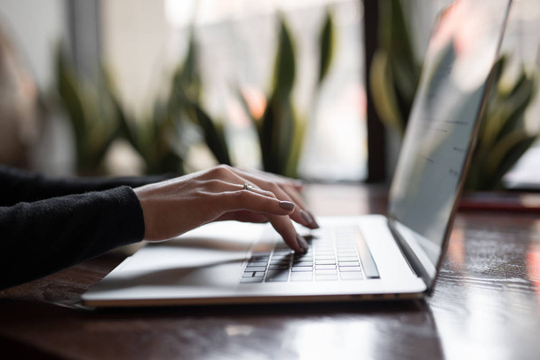 Woman hands on a laptop keyboard working typing text - Φωτογραφία, εικόνα