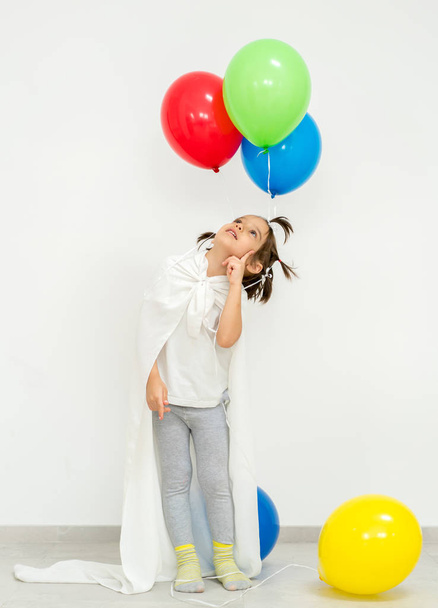 Happy boy with a bunch of balloons  - Fotoğraf, Görsel