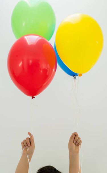Boy enjoying a bunch of balloons  - Photo, image