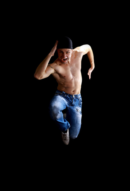 Modern dancer poses in front of the old dirty wall - Fotoğraf, Görsel