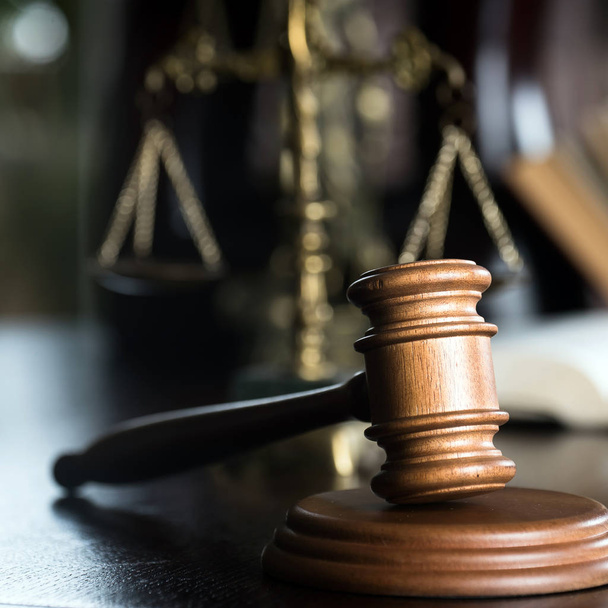 Huge judge's wooden gavel on blurred background - Foto, Imagen