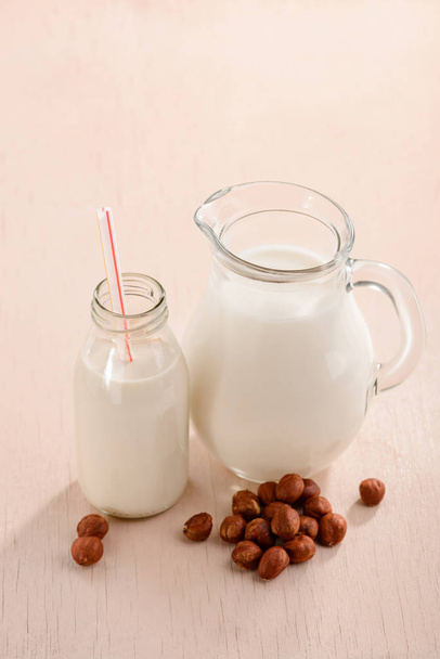 Bottle, jug of hazelnut milk - Fotoğraf, Görsel