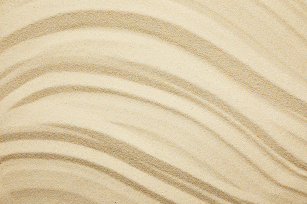 teksturowanej i złotej piaszczystej powierzchni na plaży w okresie letnim - Zdjęcie, obraz