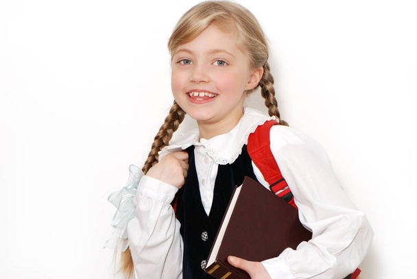 portrait of beautiful teen schoolgirl in front of white wall - Foto, imagen