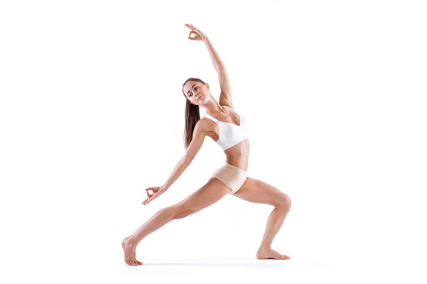 Woman working yoga exercise, full-length portrait, isolated on white. Balance and meditation. - Photo, image