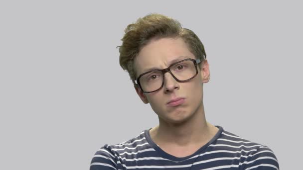 Portrait of thoughtful teenager in eyeglasses. - Footage, Video