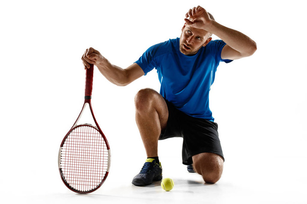 Tennis player crouching down looking defeated and sad - Photo, image