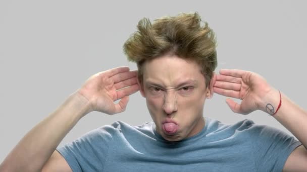 Rude teen boy making face grimace. - Footage, Video