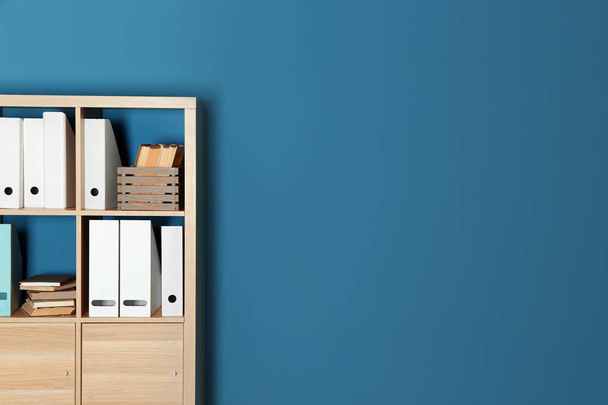 Modern shelf unit near color wall - Photo, Image