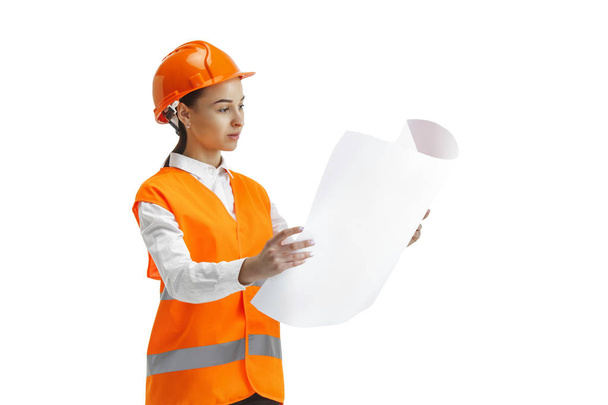 The female builder in orange helmet isolated on white - Foto, afbeelding