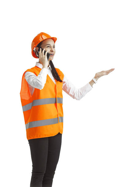 The female builder in orange helmet isolated on white - Foto, Bild