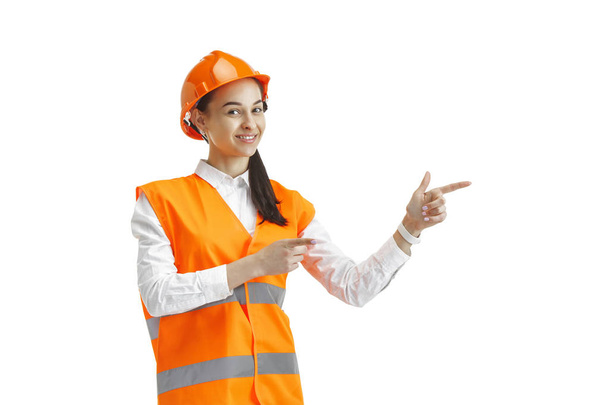 The female builder in orange helmet isolated on white - Φωτογραφία, εικόνα