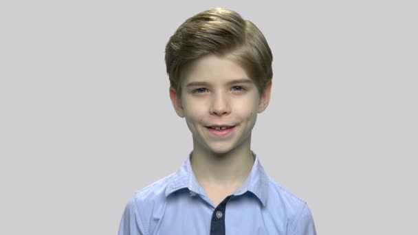 Portrait of cute child on gray background. - Footage, Video
