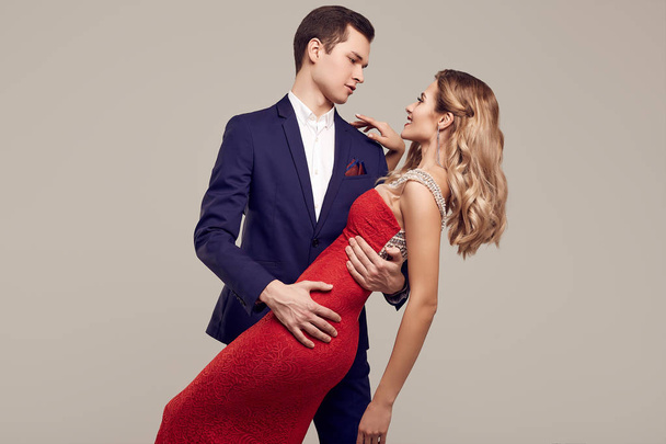 Sensual beautiful young couple dressed in formal clothes - Fotoğraf, Görsel
