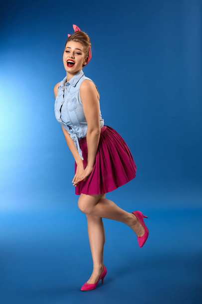 Beautiful pin-up woman on color background - Fotografie, Obrázek