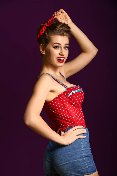 Beautiful pin-up woman on color background - Valokuva, kuva