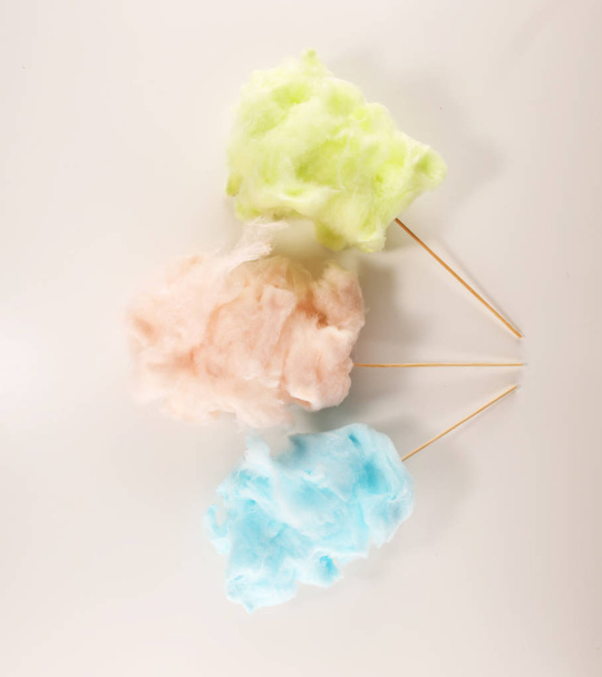 colorful cotton candy floss. sweet party food in pink and green - Фото, зображення