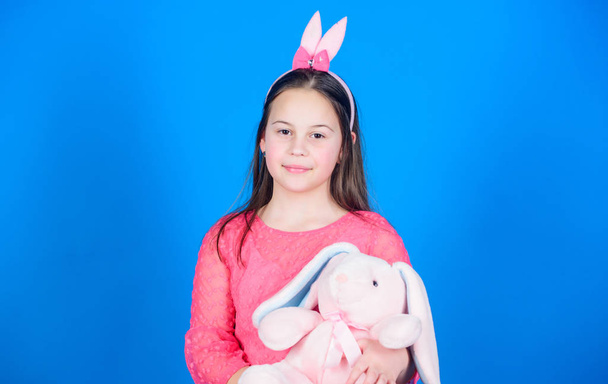 Child in rabbit bunny ears. Egg hunt. Family holiday. Little girl with hare toy. Spring party. Happy easter. Happy moments. Enjoying every moment. Great pleasure. happy little kid - Foto, Imagem