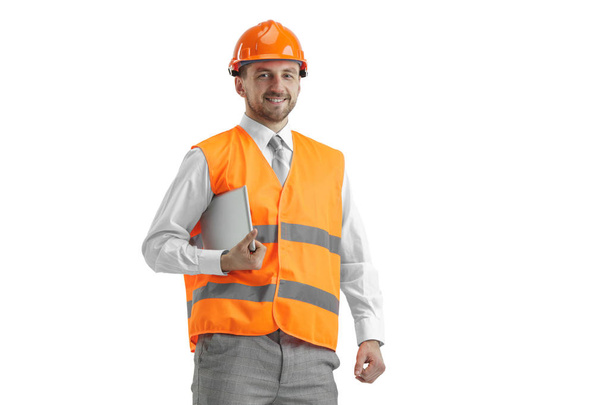 The builder in orange helmet isolated on white - Foto, afbeelding